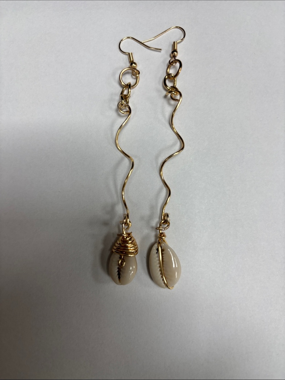 Gold Wavy Drop Earrings with Cream Cowrie Shells